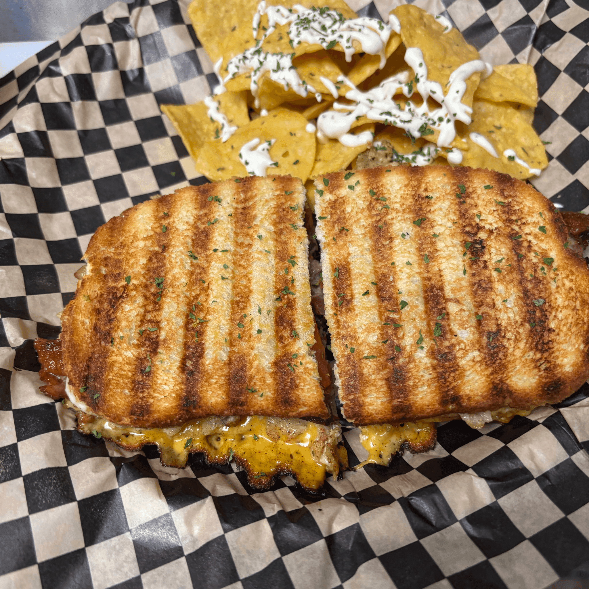 Grilled panini pressed golden, served with a side of tortilla chips