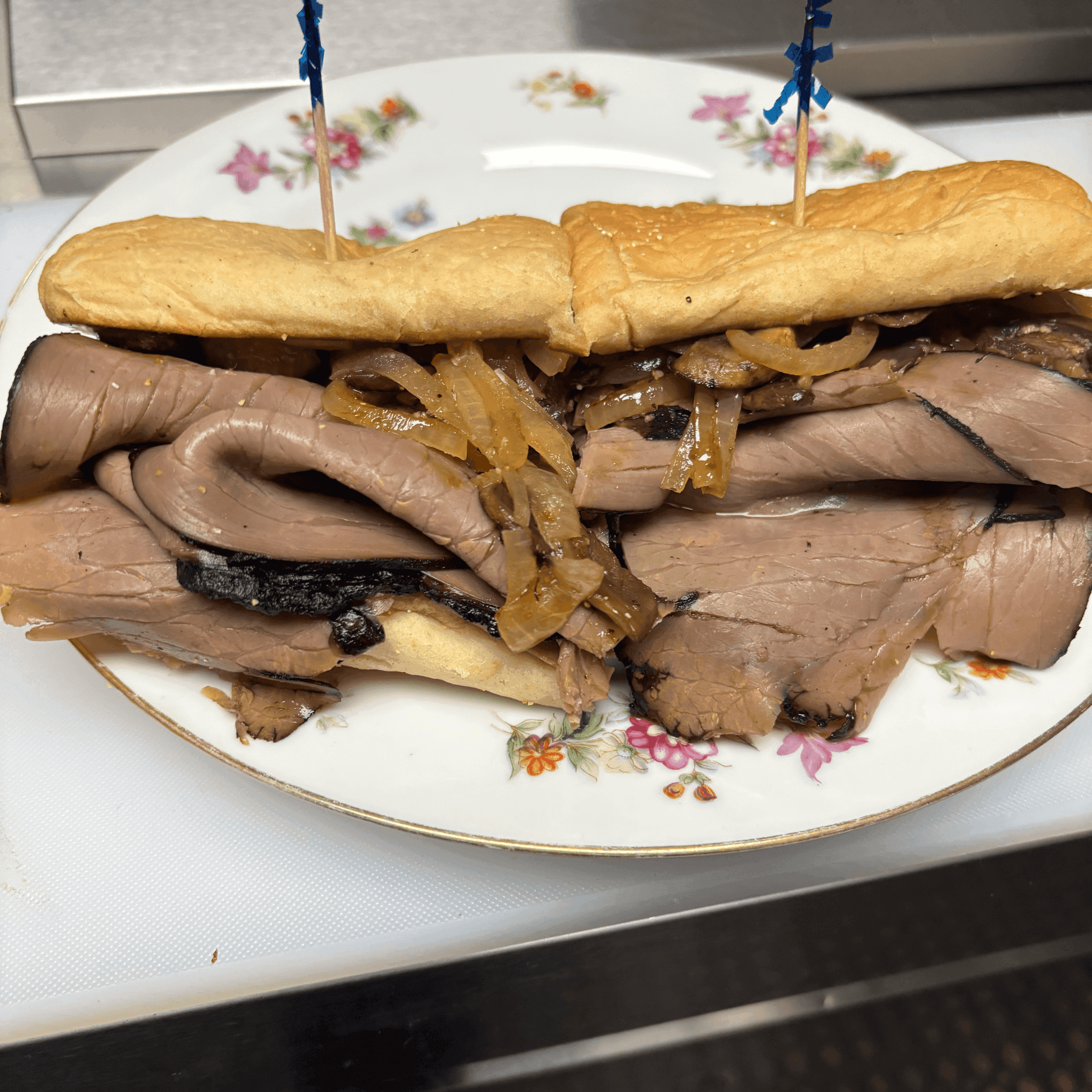 House French dip sub cut in half, served with chips
